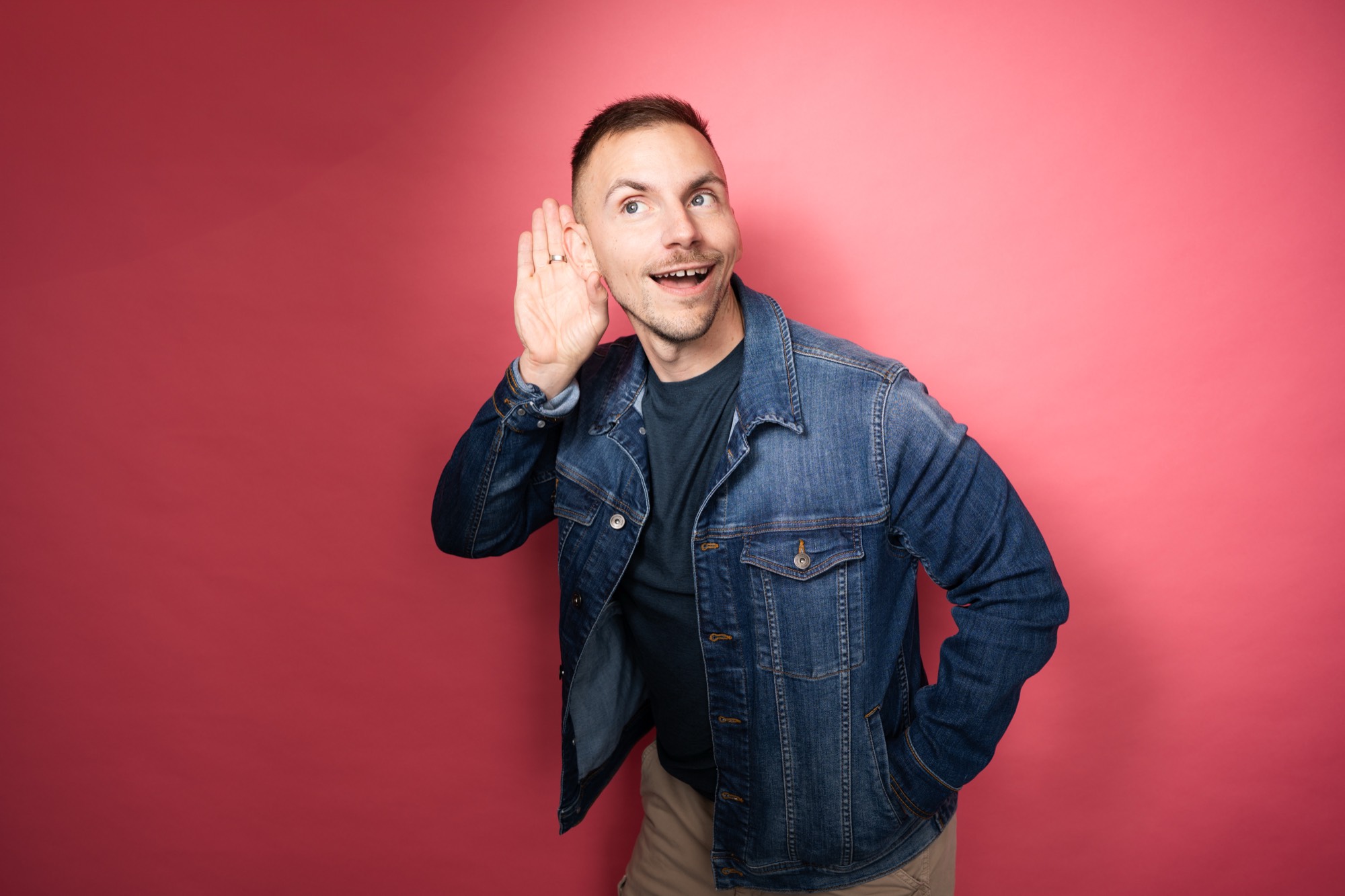 Caleb Zeringue performing stand-up on stage